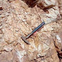 Francisca South Gold Zone channels in quartz-sericite altered intrusive with WNW quartz-hematite-jasperoid paralel veining systems