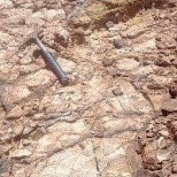 Francisca South Zone strong limonite-hemitite infilled fractures in sericite – argillic altered intrusive